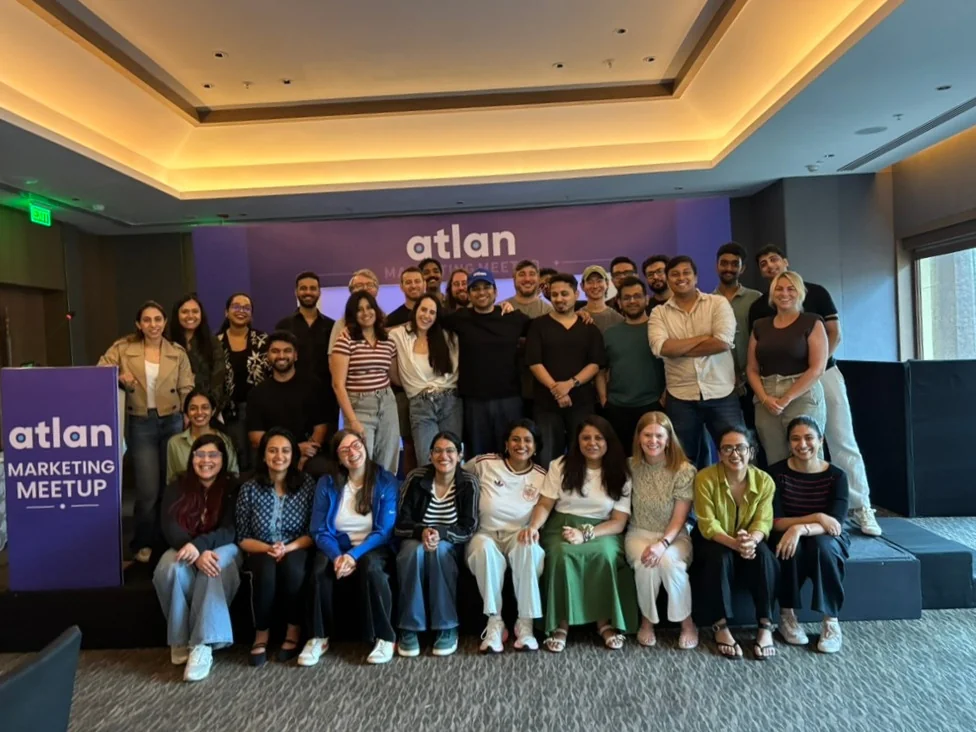 The Atlan marketing team at the H2 kickoff, gathered on and around the stage.